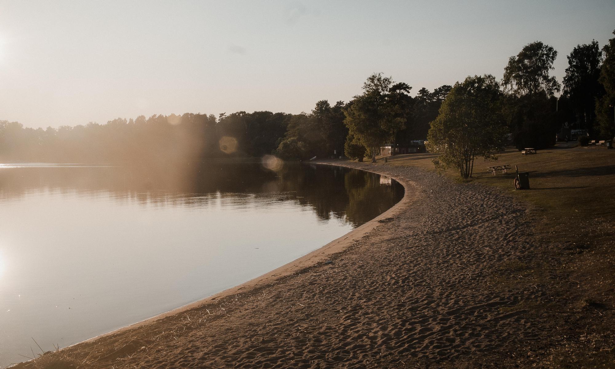 a beach, sand and water early in the morning